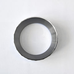 A bird's eye view looking directly through the hollow center of the WENDOUGEE 58mm portafilter ring on a plain background.