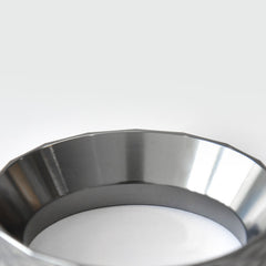 An extreme close-up of the smooth polished inner wall of the WENDOUGEE coffee funnel designed to prevent coffee grounds from sticking.