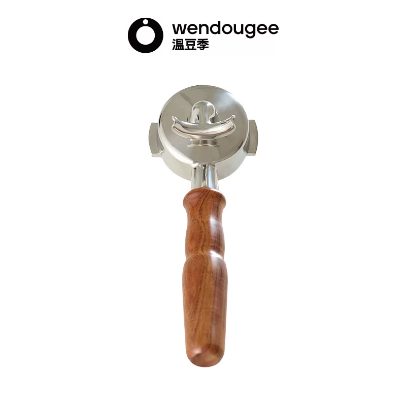 Bottom view of the wendougee dual spout espresso portafilter highlighting the symmetrical split spout design.
